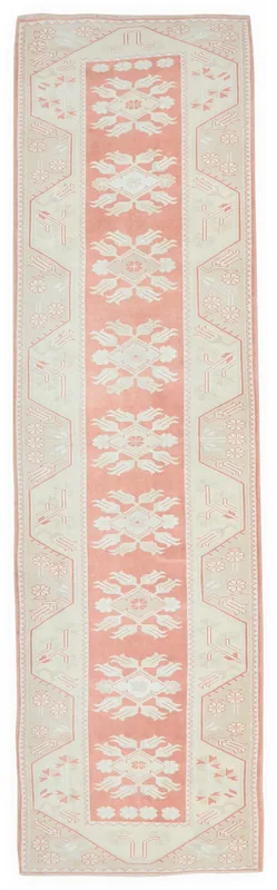 Full top view of the 3'1" x 12'2" vintage Anatolian runner with rose and ivory floral geometric patterns.