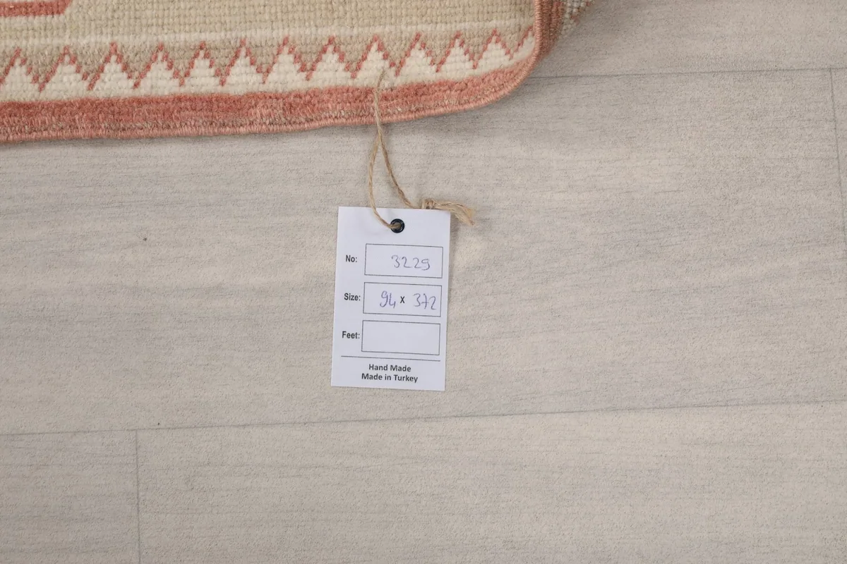Tag displaying the rug's unique number and size, confirming its hand-made origin in Turkey.