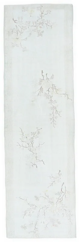Full overhead view of the 2'10" x 9'10" ivory vintage runner rug with branch motifs on a white background.