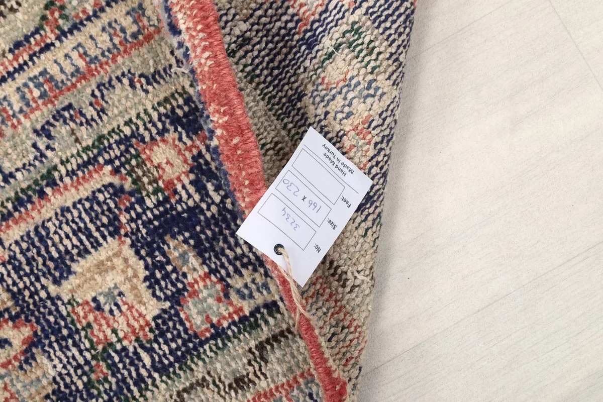 Label attached to the rug, showing size and other details