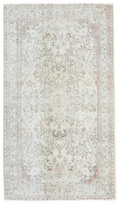 Full overhead view of the 5'6" x 8'2" ivory vintage Anatolian rug on a white background