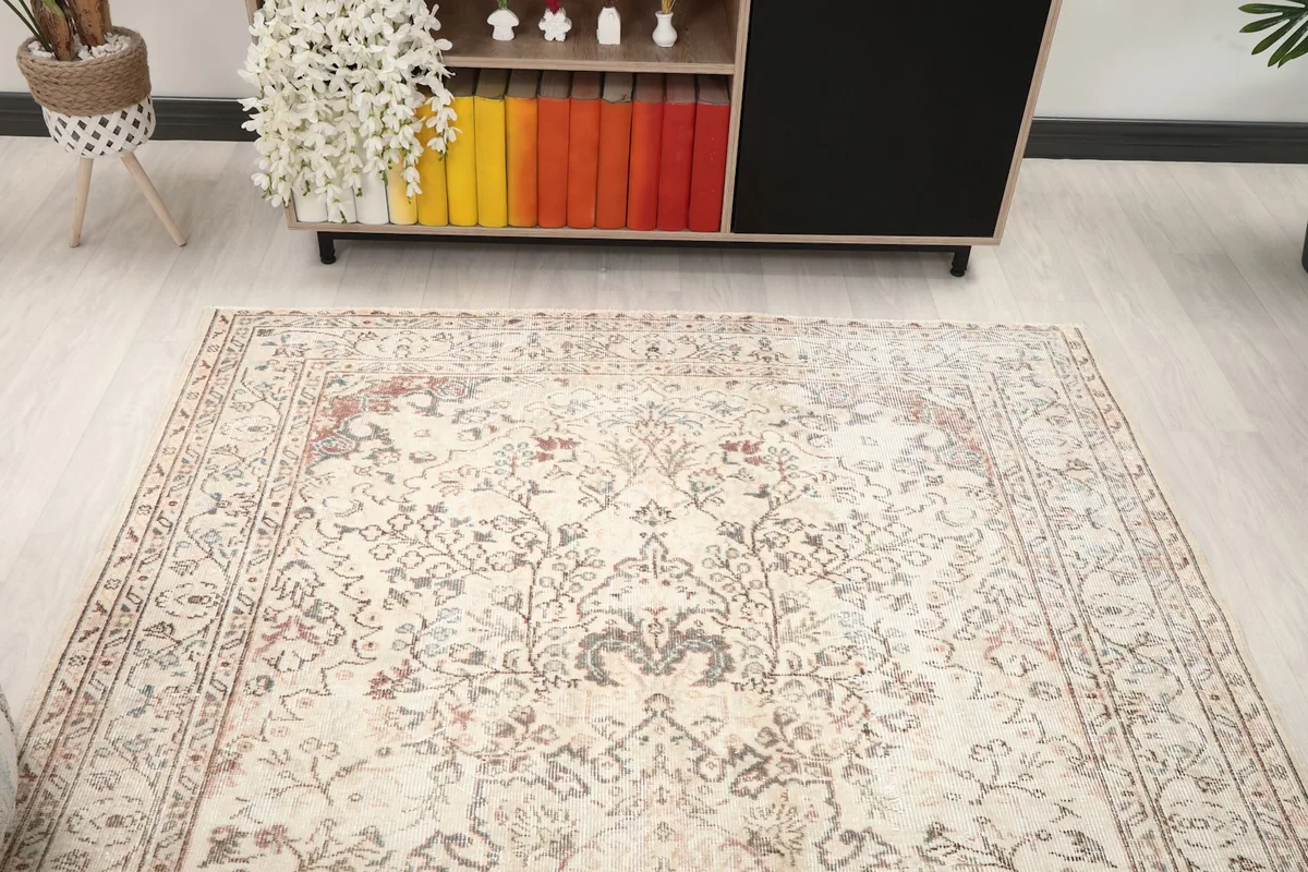 View of the rug from another angle in the room, showing its full length and interaction with furniture