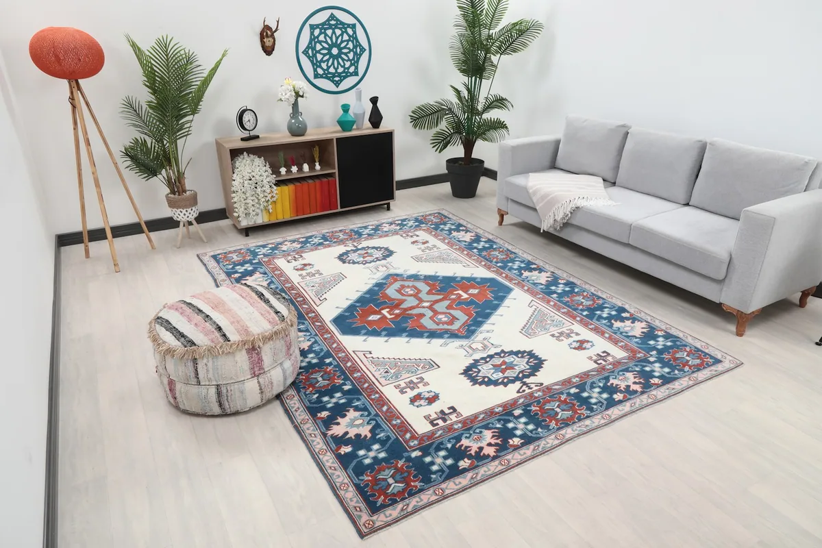 Angle view of the rug in a living room, showing its scale with furniture
