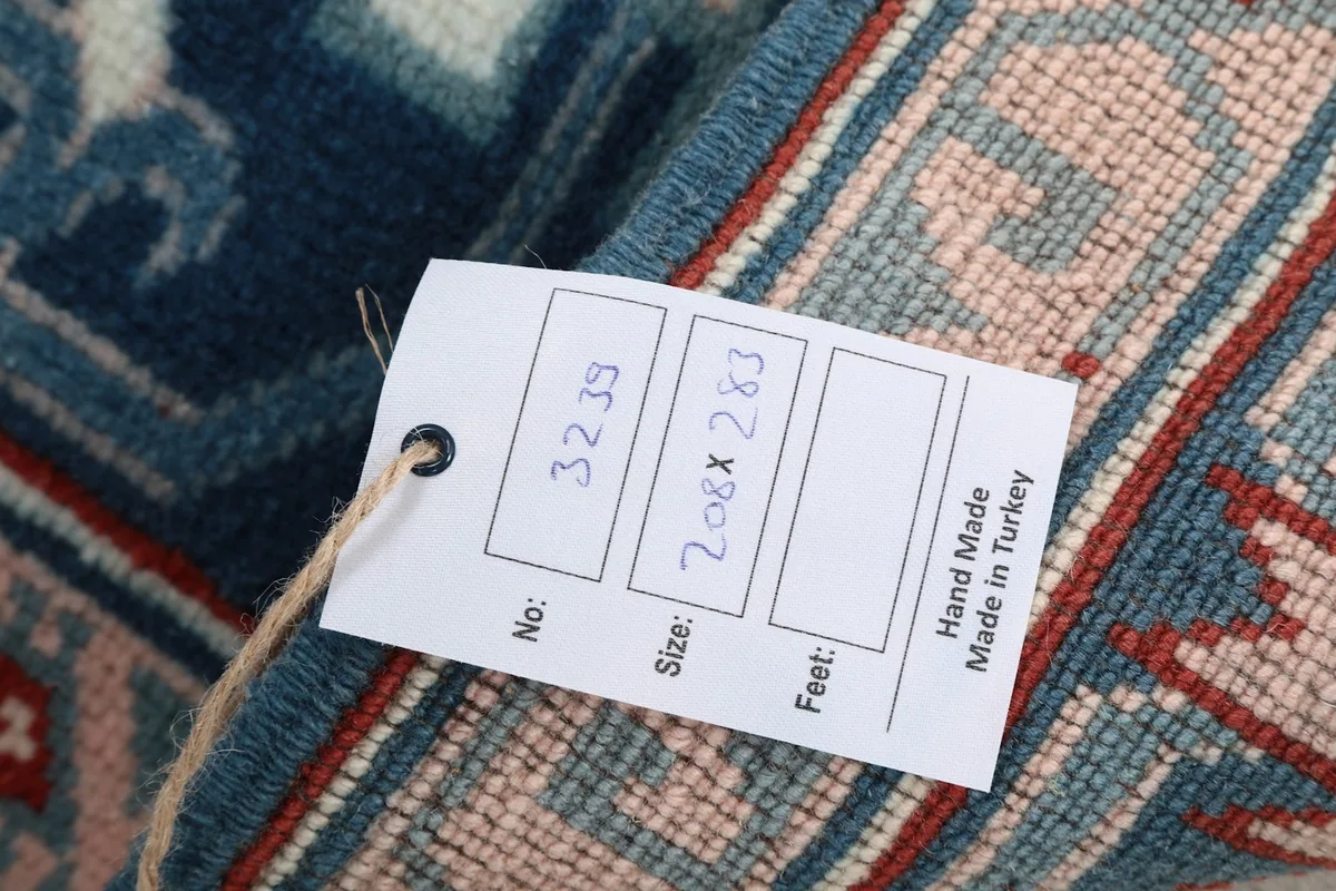 Product tag showing the rug's size and 'Hand Made in Turkey' information