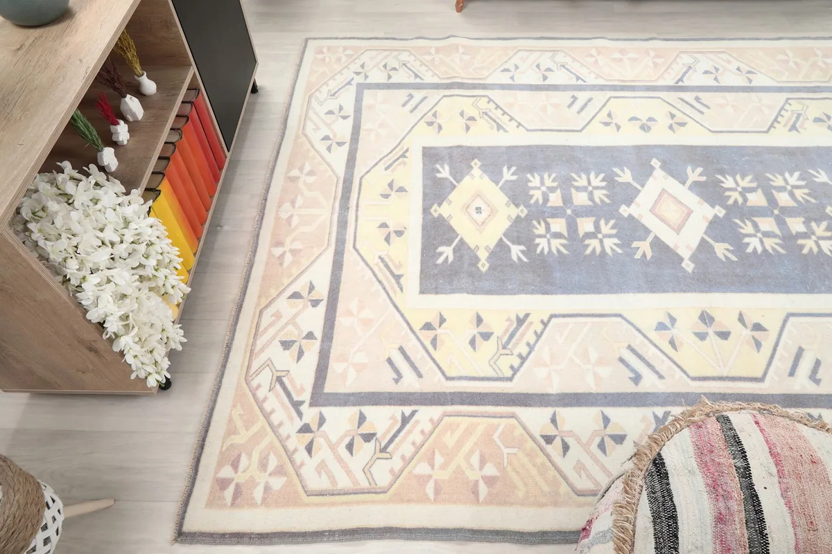 Angled view of the rug in a room, capturing its texture and how colors blend with surrounding decor.