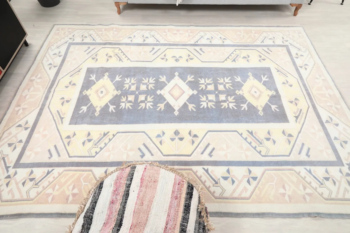 Full overhead view of the rug, emphasizing its medium size and dominant blue and beige palette.