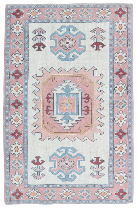 Full top view of the 4x6 cream and pink vintage Anatolian rug with geometric motifs