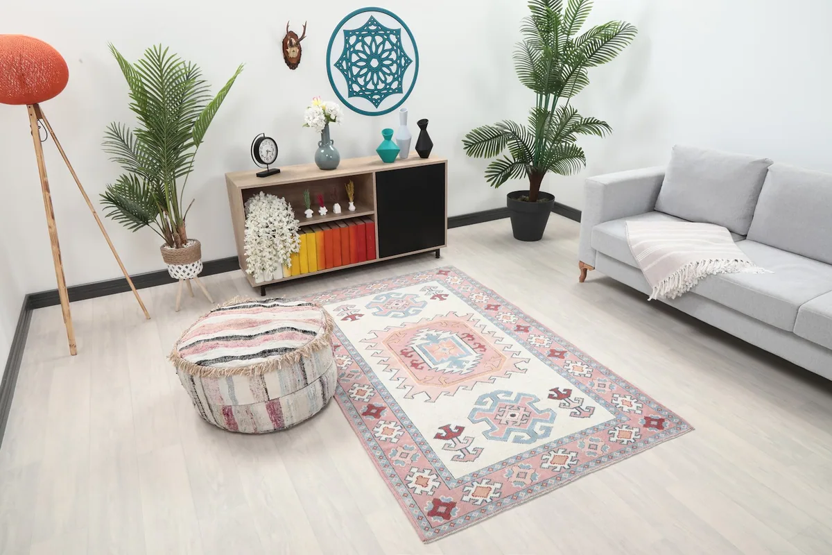 Overhead view of the vintage Anatolian rug in a room, showing its placement relative to furniture