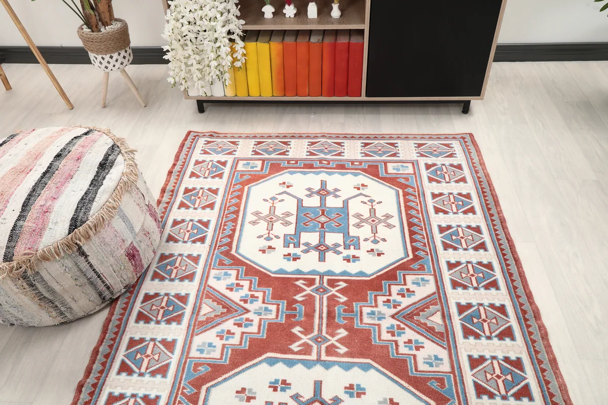 Rust Ivory Geometric Anatolian Rug in a room, offering a wider perspective of its integration