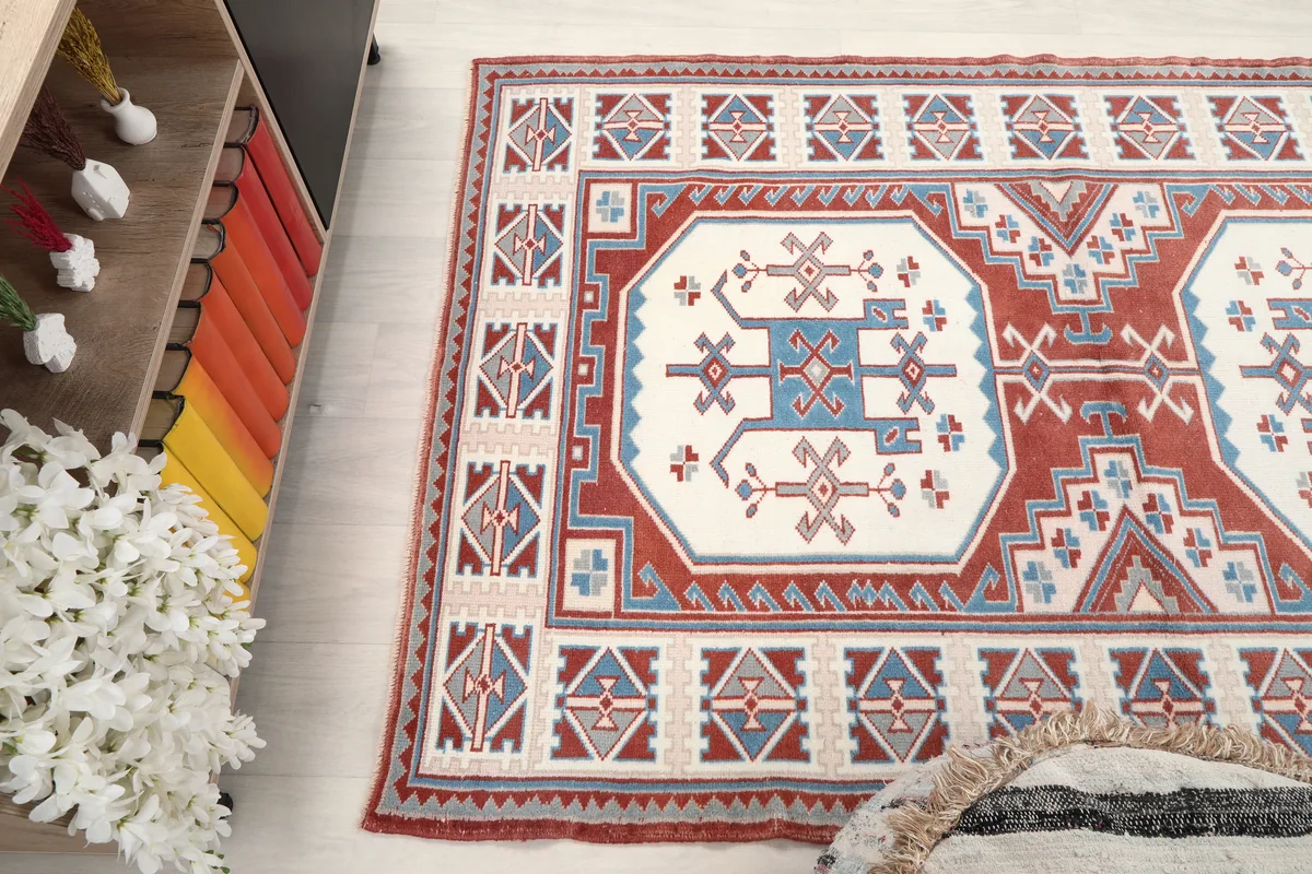 Rust Ivory Geometric Anatolian Rug viewed from above, showcasing its symmetry and colors