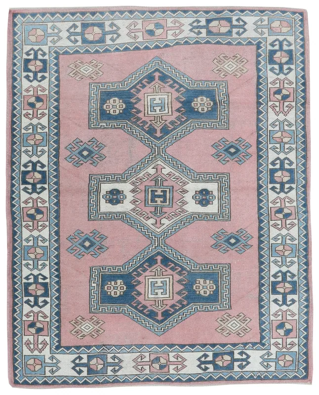 Full overhead view of the rose and blue geometric Anatolian rug