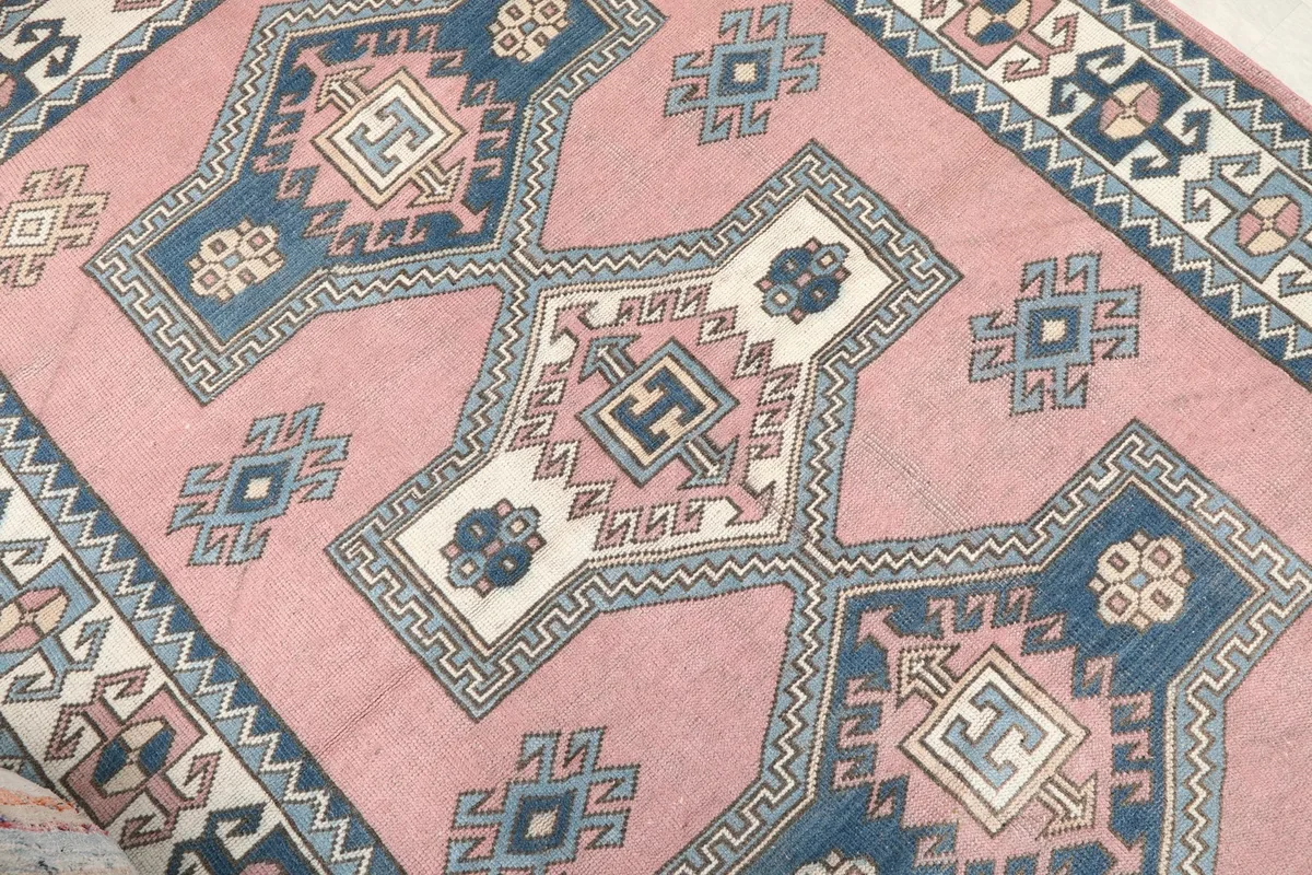 Close-up of the central geometric design and surrounding tribal elements
