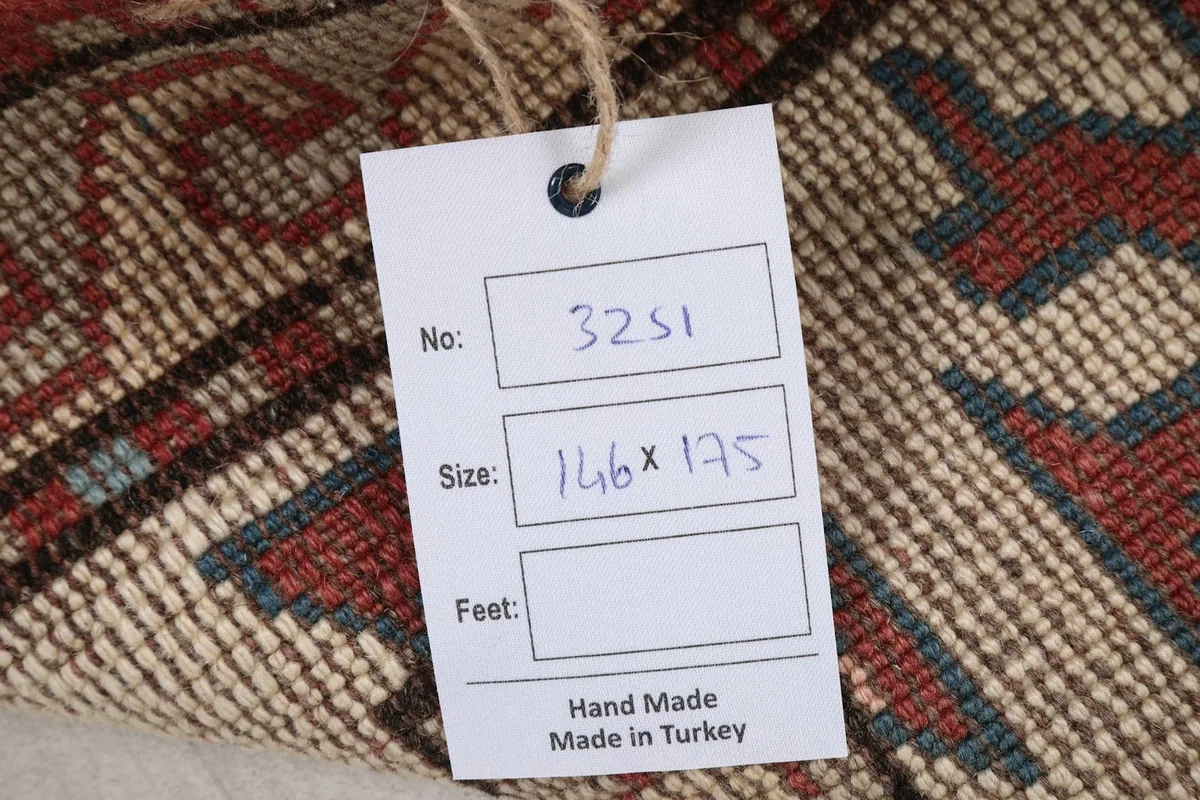Tag showing the rug number and size in centimeters, indicating it is handmade in Turkey
