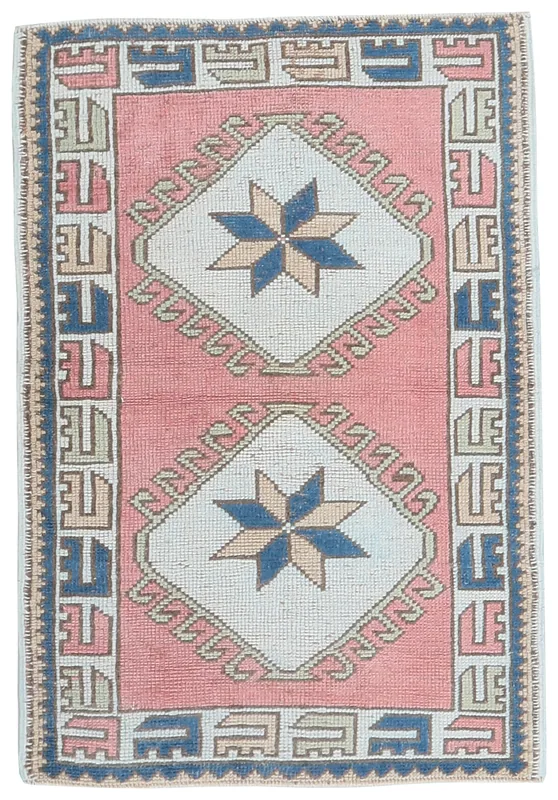Rose Geometric Star Rug, full top view showing the rose field, ivory medallions, and navy border.