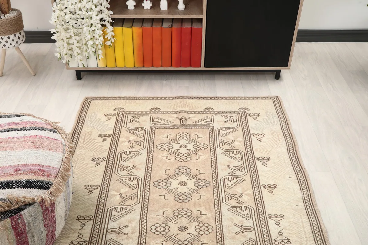 Overhead view of the rug placed in a room, showing its full length and design from a higher perspective.