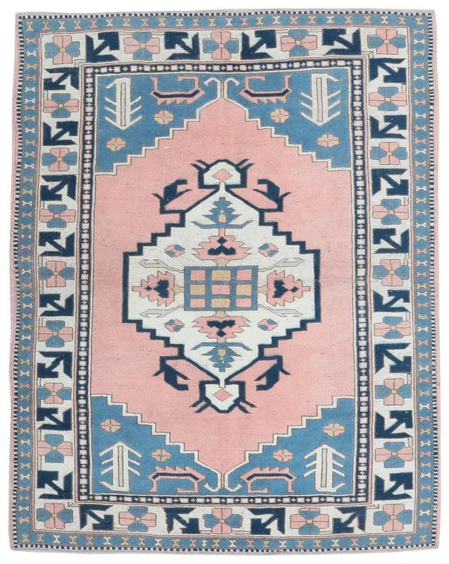 Top view of a pink and blue vintage Anatolian geometric wool area rug