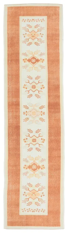 Full top view of the 2'7" x 10'4" vintage Anatolian runner rug with rust border and ivory geometric motifs