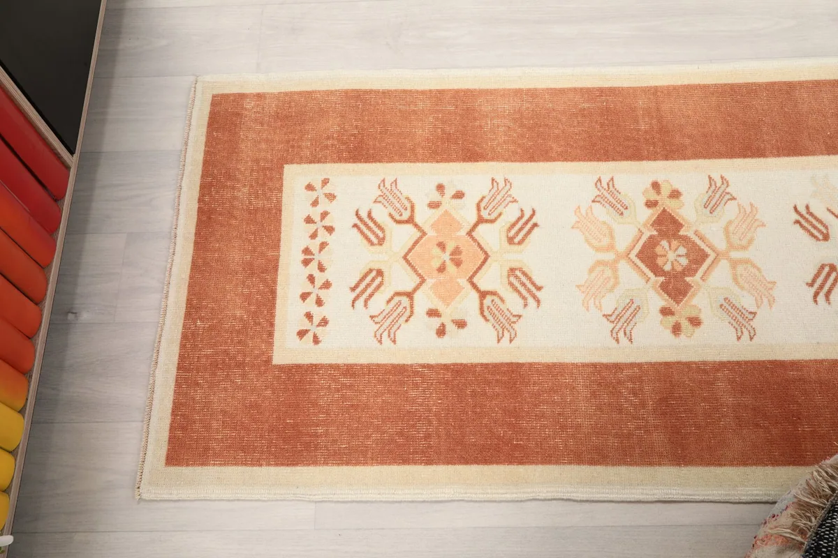 Overhead view of a section of the runner, showcasing the repeating geometric motifs and border design