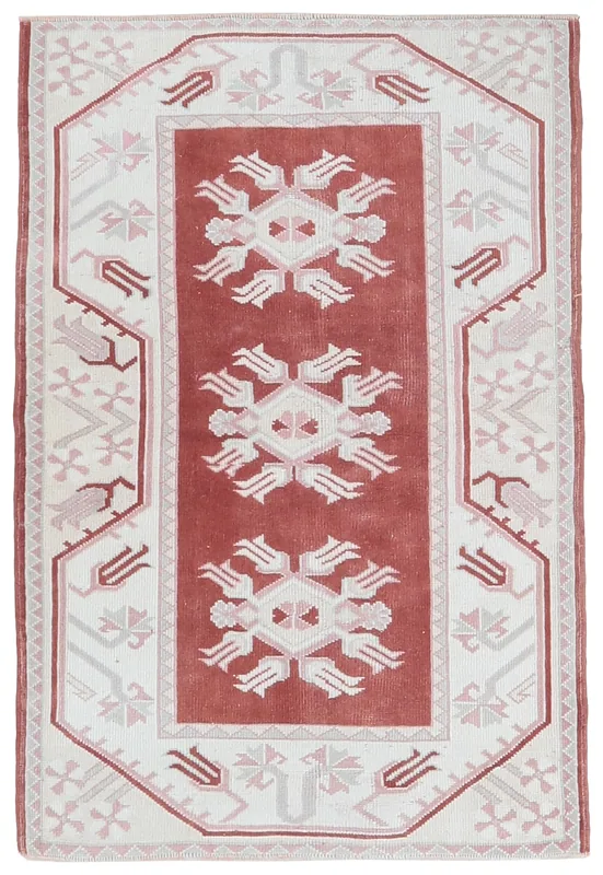 Full overhead view of the 2'9" x 4'3" vintage Anatolian rug with red field and ivory border