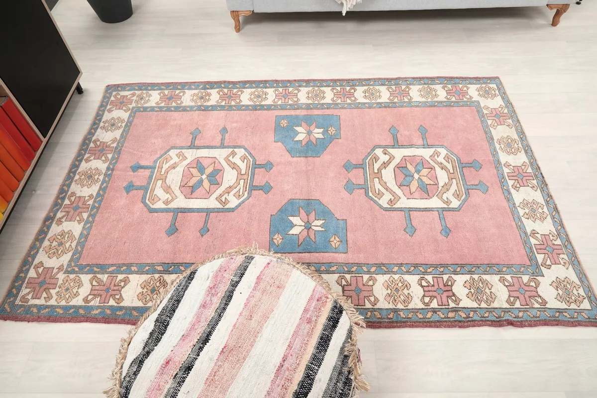 Overhead perspective of the rug, emphasizing its balanced geometric layout