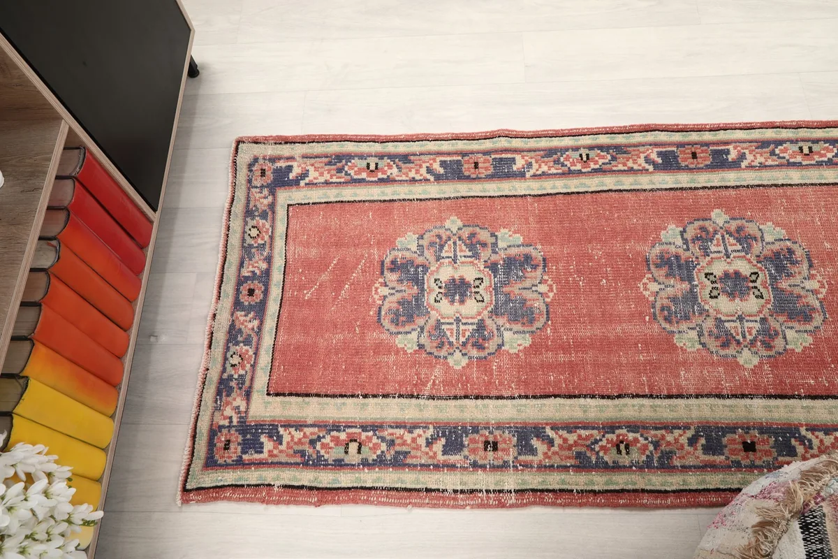 Overhead shot of a section of the runner, featuring two medallion motifs and border details
