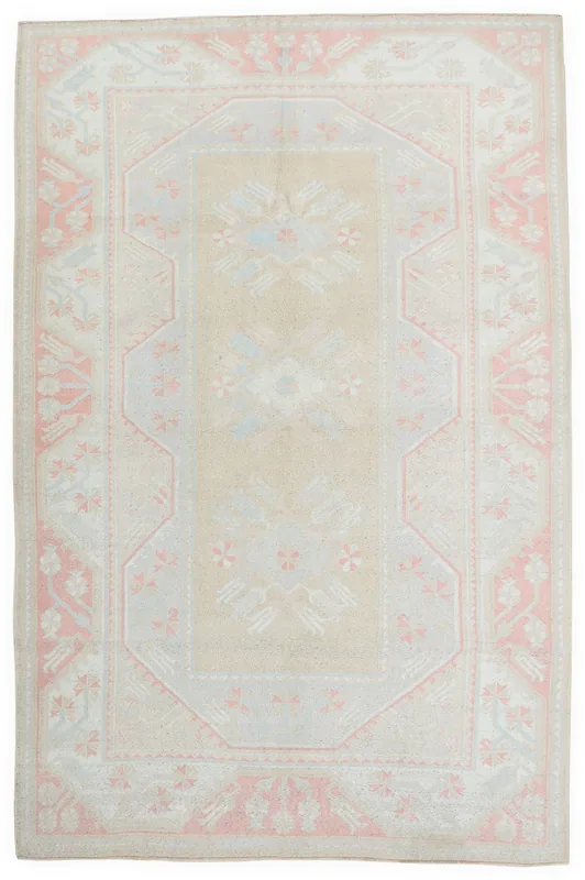Full overhead view of the beige and rose geometric Anatolian vintage rug