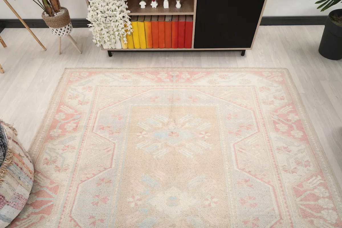 Overhead view of the vintage rug in a room, highlighting its placement