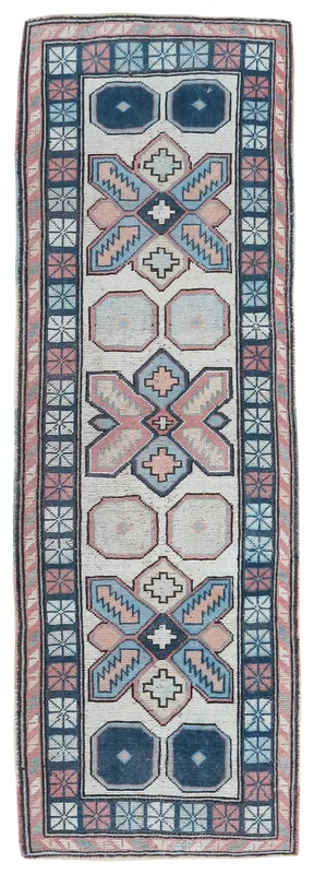 Full overhead view of the 2'7" x 7'0" cream, navy, and rose geometric vintage Anatolian runner rug.