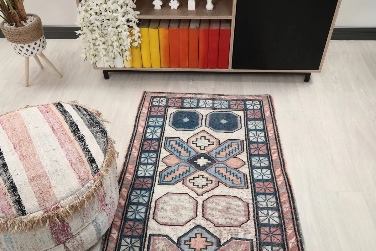 Overhead view of the runner rug in a room setting, focusing on its placement relative to furniture.