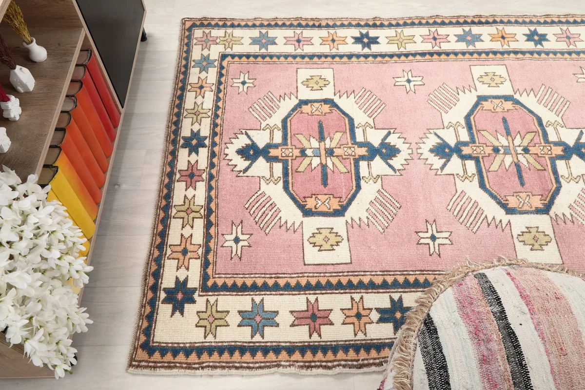 High angle shot of the rug showing its full length and width in a room setting.