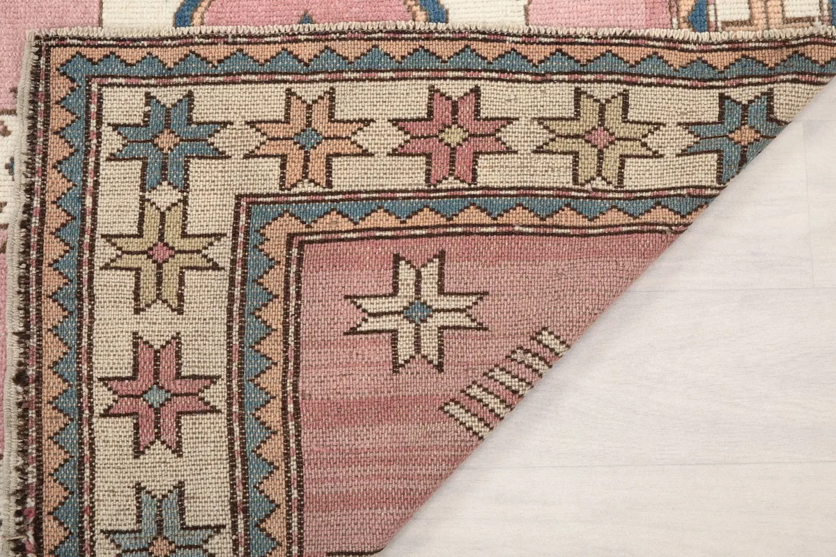 Another folded corner view, showing the texture and construction of the hand-knotted wool.