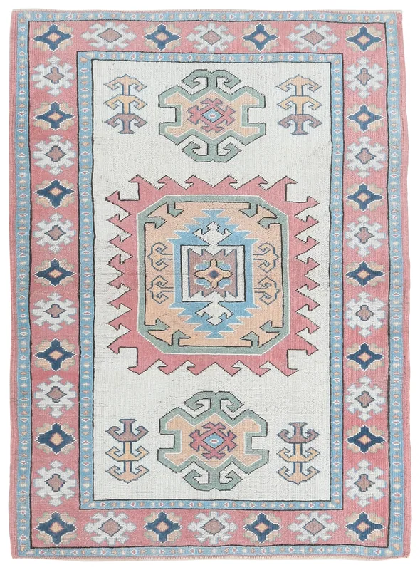 Full top view of the vintage Anatolian rug with cream field and rose border