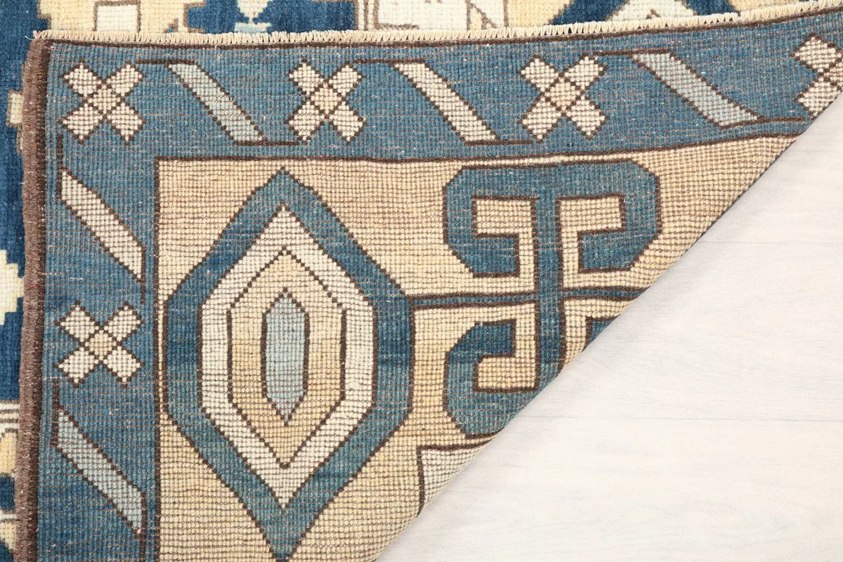 Another view of the rug's underside and folded corner, showing the craftsmanship.