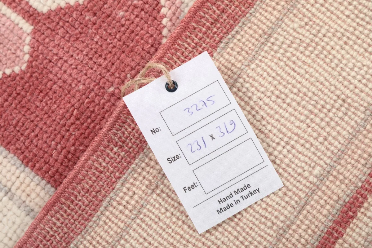 Label on the rug's back confirming hand-made origin and dimensions