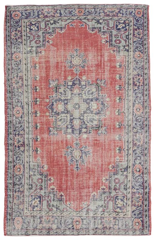 Full overhead view of the vintage Anatolian rug with red field and navy medallion