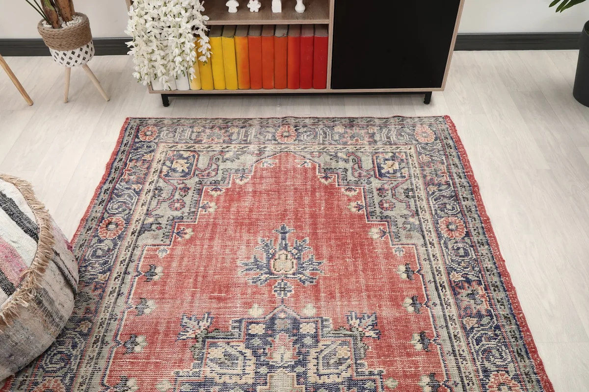 Overhead angle of the rug in a room, highlighting its placement and colors