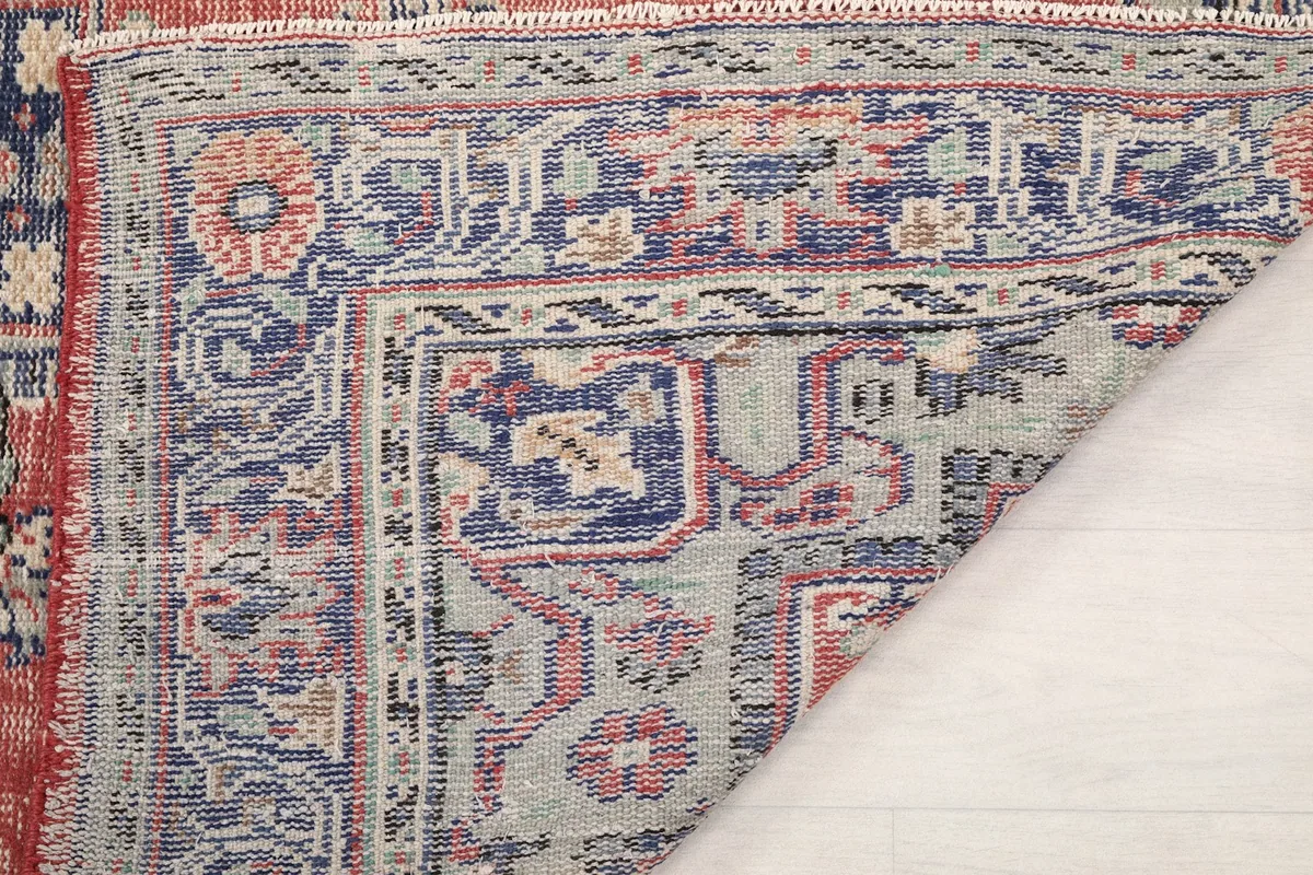 Close-up of the rug's back, revealing the intricate knotting and craftsmanship