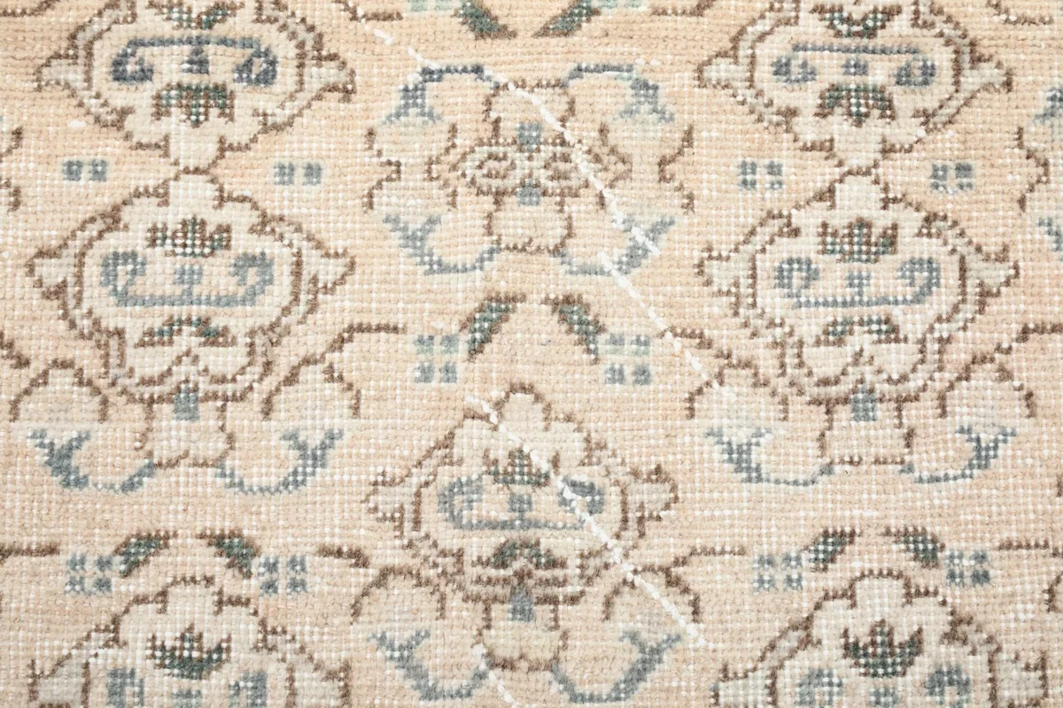 Close-up of the low wool pile, showing the hand-knotted texture and color variations