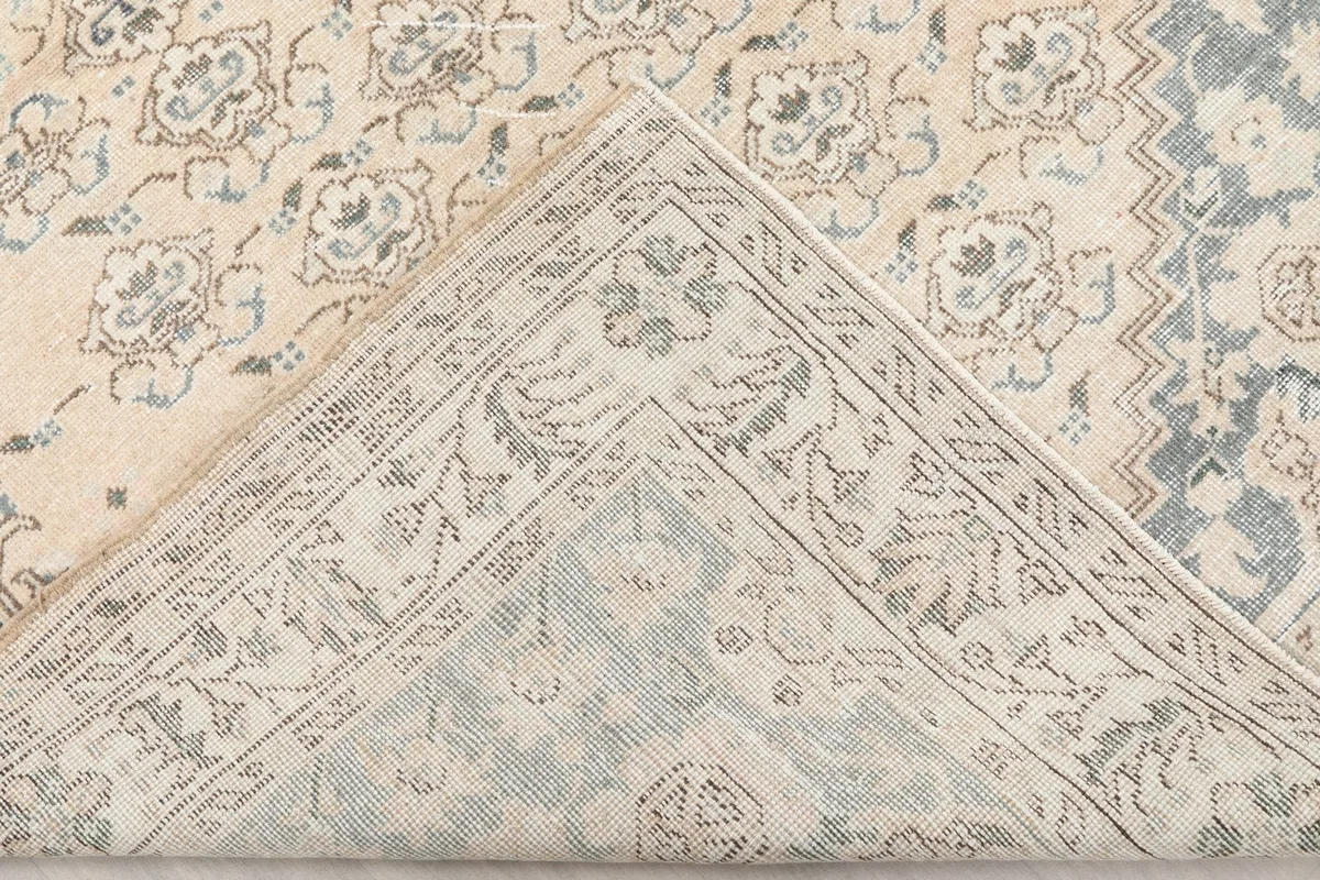 View of the back of the rug, showing the reverse of the hand-knotted construction