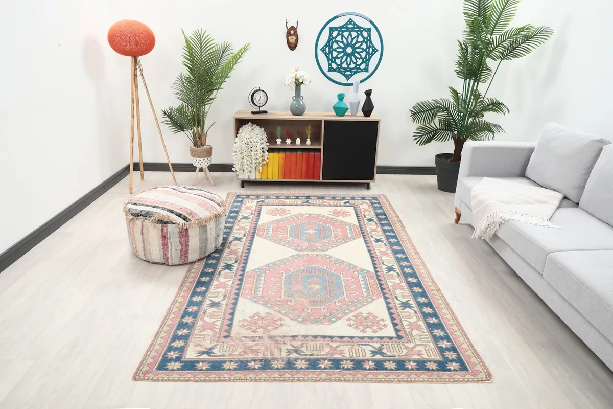 Anatolian rug in a modern living room setting with light furniture and plants