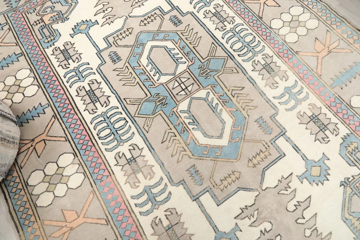 Overhead angle view of the rug's central medallion and surrounding geometric motifs