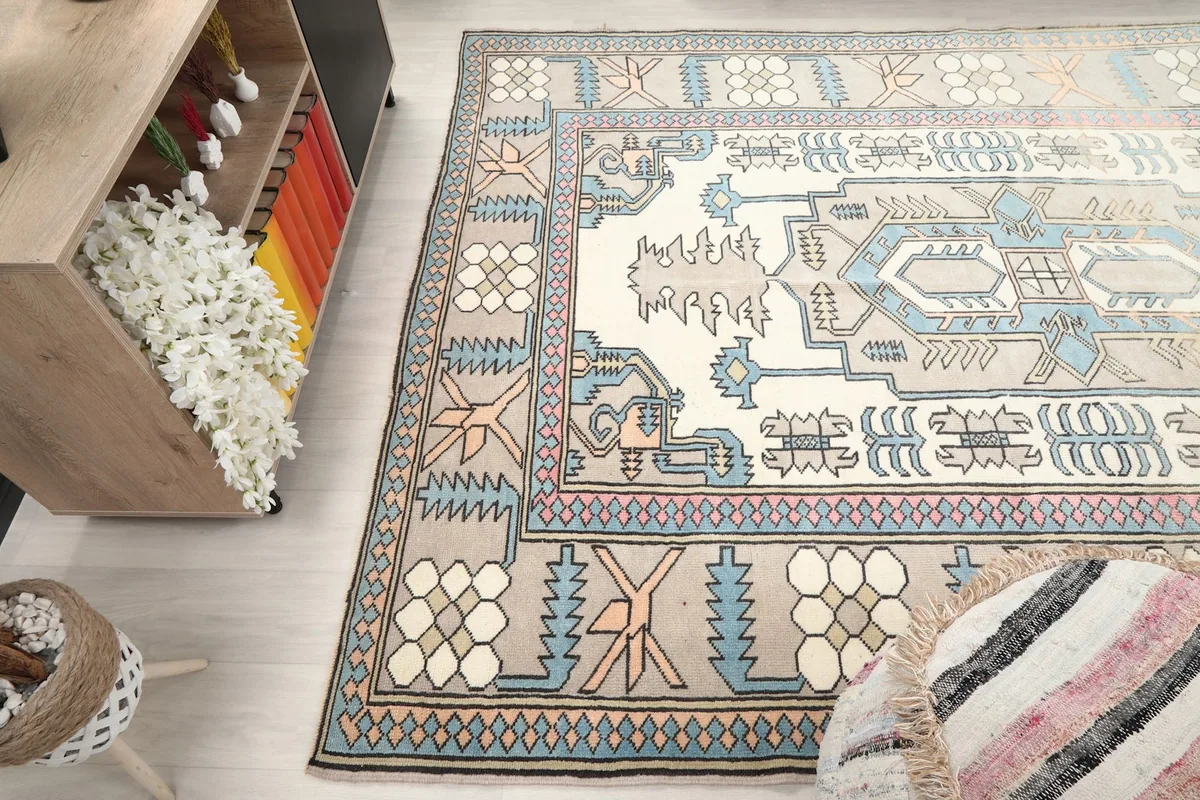 View of the rug from another angle in the room, with furniture on the side