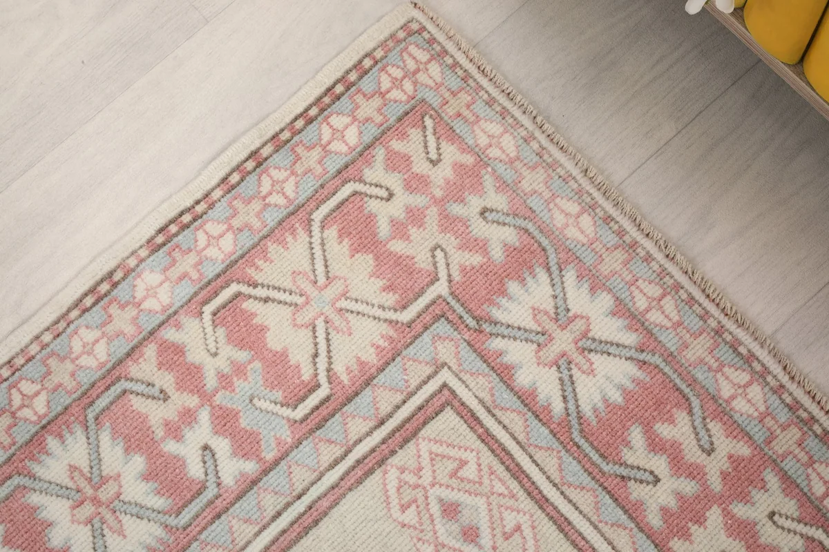 Close-up of a corner, revealing the intricate patterns and color variations in the border