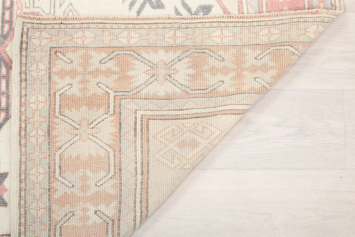 Close-up of the rug's reverse side, revealing the quality of the hand-knotted wool on cotton foundation