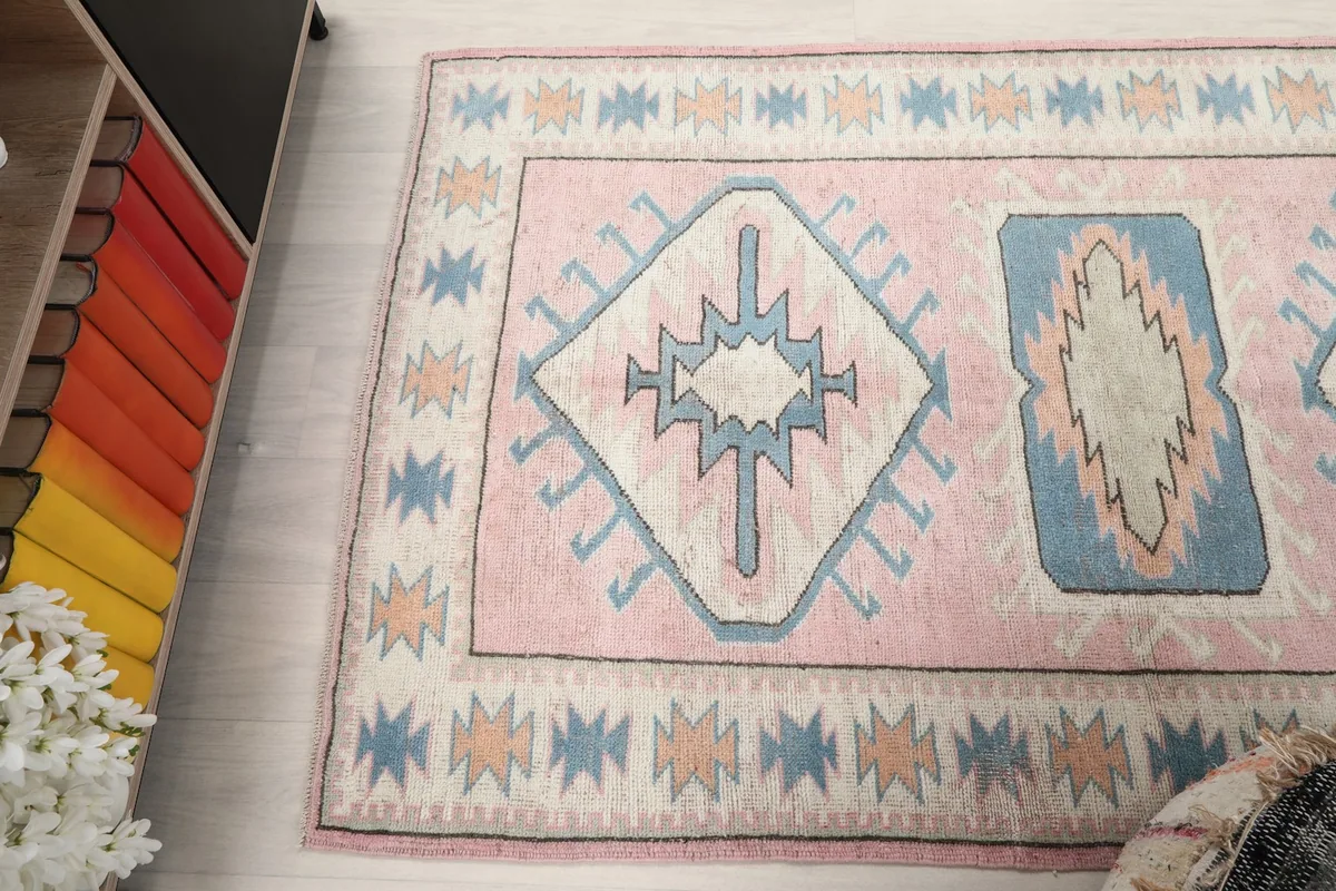 Angled view highlighting the rug's geometric patterns and colors from a higher perspective.