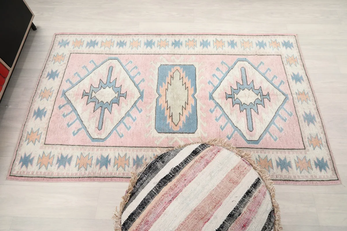 Full overhead view of the rug in a room setting, showing its complete design and size.