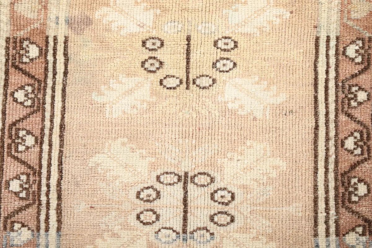 Close-up of the Faded Rose Tribal Anatolian Rug's low wool pile, revealing the knotting and texture.
