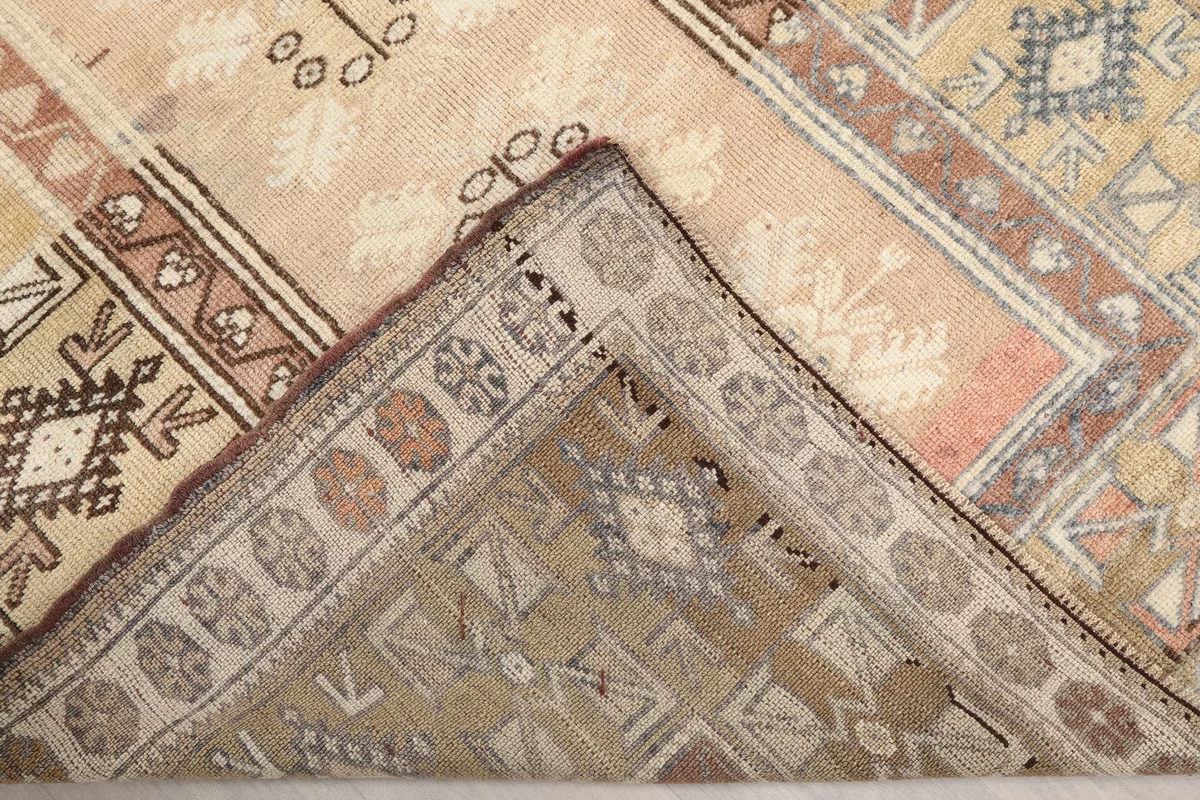 Faded Rose Tribal Anatolian Rug's back, showing the hand-knotted cotton foundation and wool pile construction.