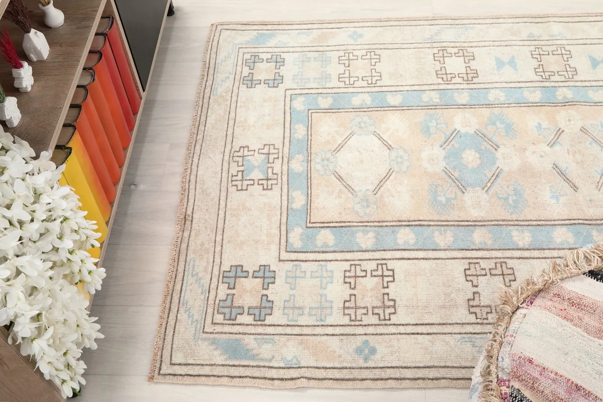 Overhead angle of the rug in a room, emphasizing its size and design.