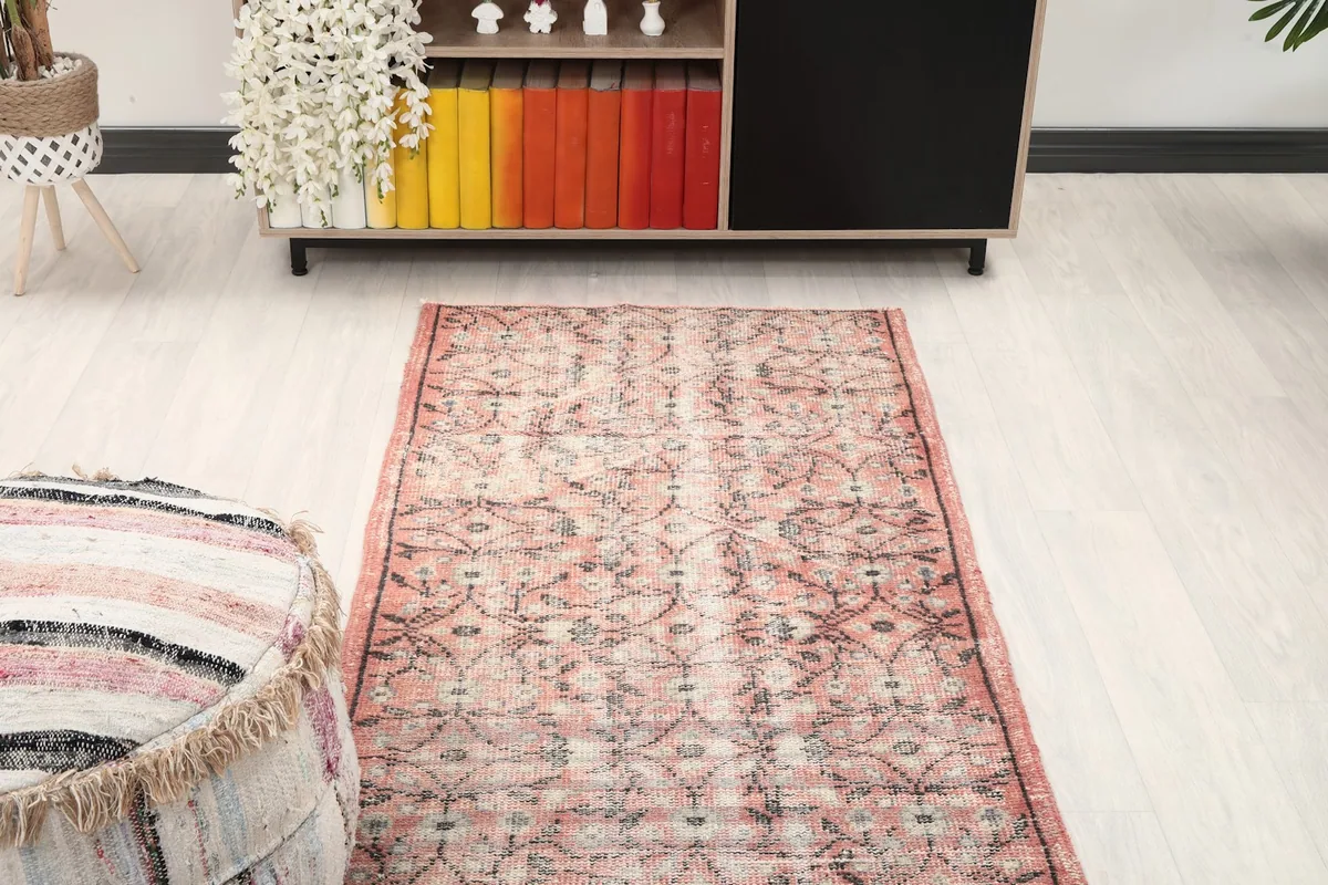 Overhead view of a section of the runner rug in a room, showing its placement relative to furniture.